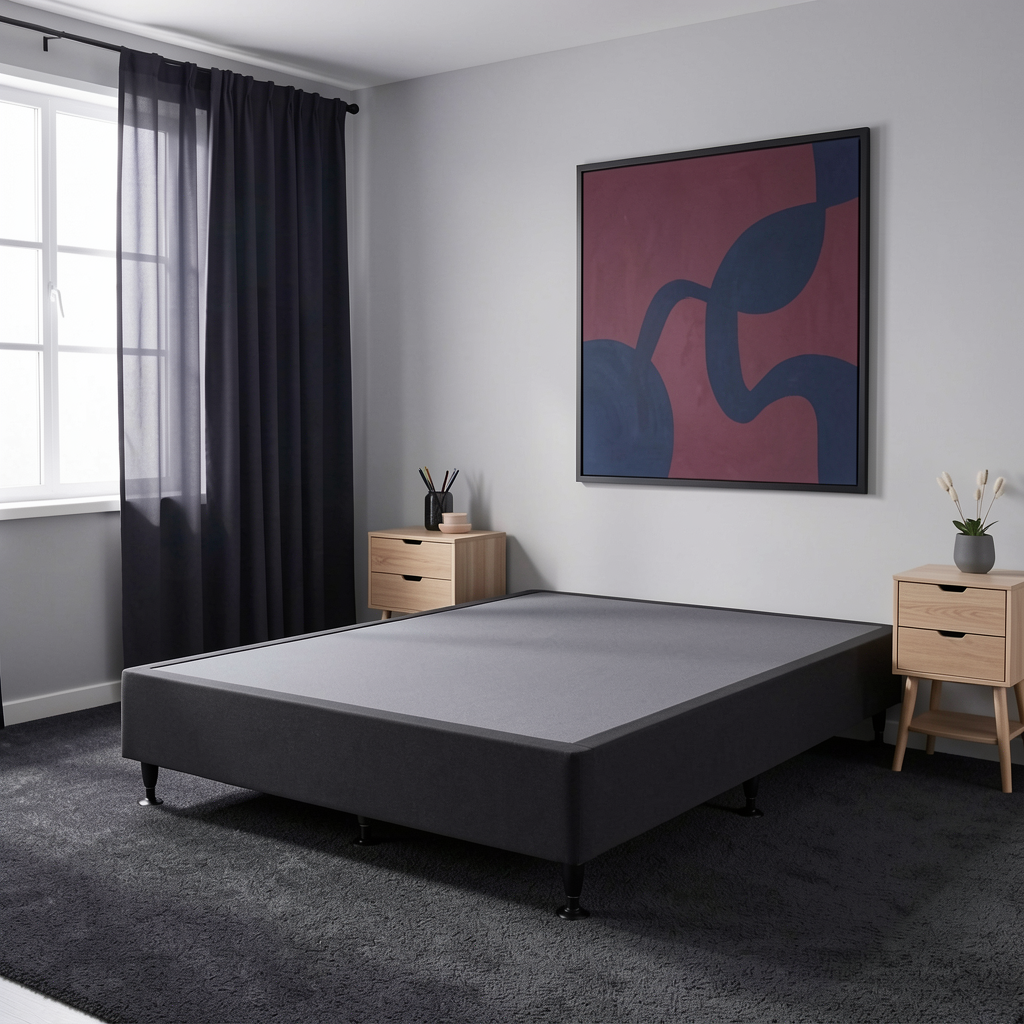 A SleepMaker Connect kitset bed frame with a matching mattress, shown in a modern bedroom setting with a window, dark curtains, and light wood nightstands.