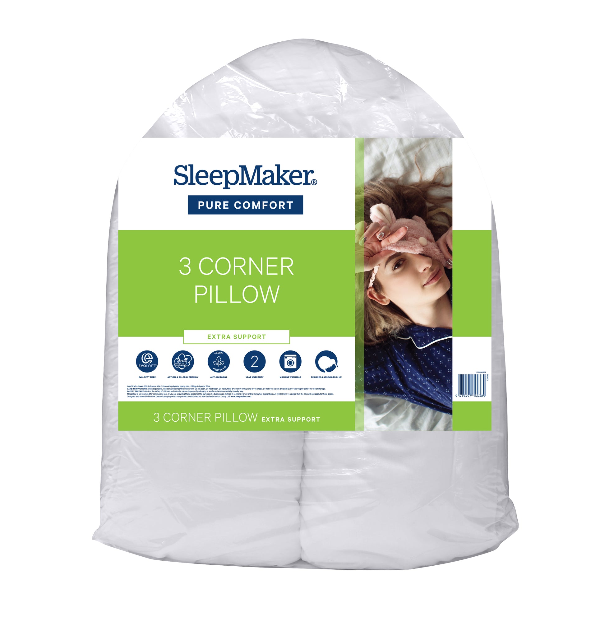 A packaged SleepMaker Pure Comfort 3 Corner Pillow, shown in its clear plastic wrapping with a green and white paper label featuring a photo of a woman resting.