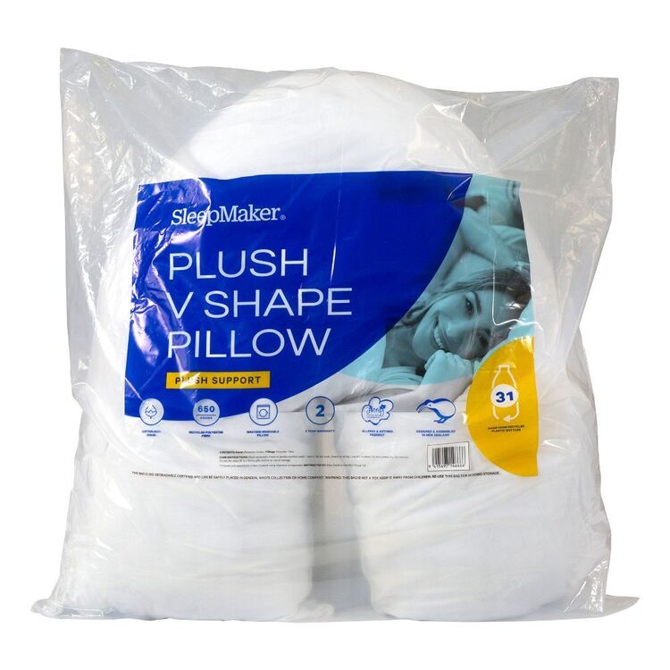 SleepMaker Plush V Shape Pillow in a clear plastic bag with a blue and white product label, showing white pillow inserts inside.